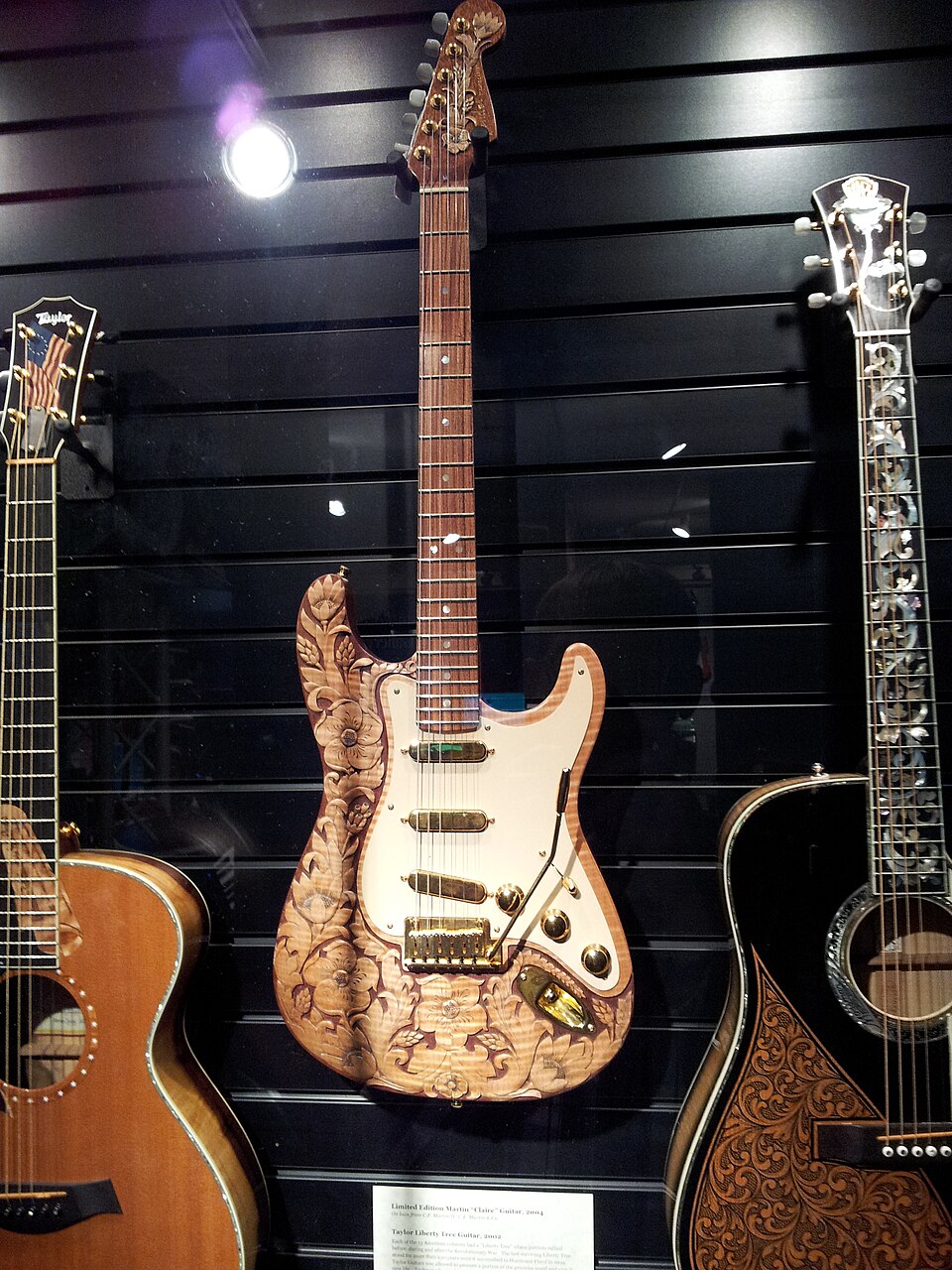 Fender Carved Floral Stratocaster (2004), Taylor Liberty Tree Guitar (2002), Museum of Making Music.jpg